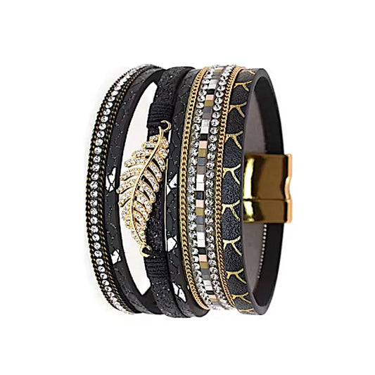 Bracelet Fougère noir multi-rangs en cuir microfibre, vue de profil, feuille dorée centrale et finitions strass sur plusieurs rangs.