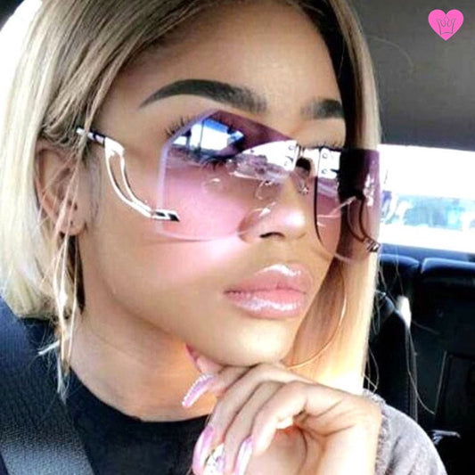 Lunettes de soleil femme tidal mirror avec optiques anti-UV dégradées sur monture invisible avec branches dorées originales