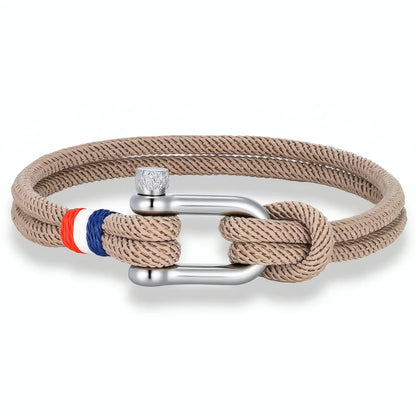 Bracelet Altra teinte beige sable lumineuse dotée d'un cordon double et d'une manille.
