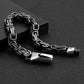 Bracelet biker avec chaîne à maillons complexes de sept millimètres avec fermoir sécurisé en acier inoxydable - chaîne virile ouverte et présenté sur une boite noire - coloris argent vieilli