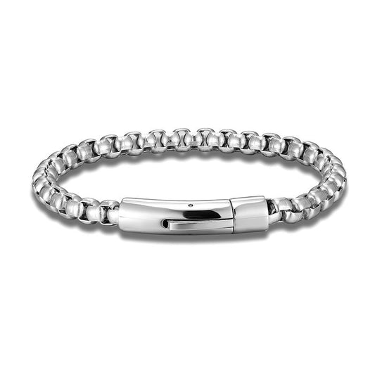 Bracelet avec chaîne à maillons vénitiens de 6 mm en acier inoxydable, son fermoir et un tube clip à ressort - présenté fermé et plat sur un fond blanc - coloris argent