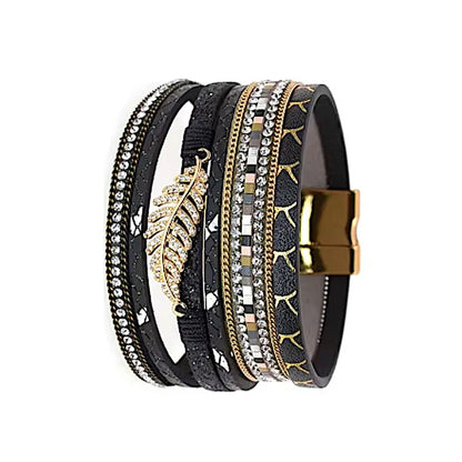 Bracelet Fougère noir multi-rangs en cuir microfibre, vue de profil, feuille dorée centrale et finitions strass sur plusieurs rangs.