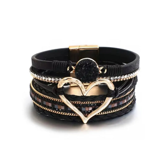 Bracelet Cœur de Lune Vagabonde noir en cuir microfibre. Le cœur doré ajouré attire le regard sur cette pièce intemporelle.