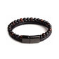 Bracelet double rang en cuir tressé noir, sublimé par des perles d’œil de tigre rouge aux reflets chaleureux et des perles d’onyx noire. Le fermoir magnétique noir brillant complète ce bijou au style audacieux et moderne. Présenté à plat sur un fond blanc minimaliste, il met en valeur ses contrastes et son élégance.