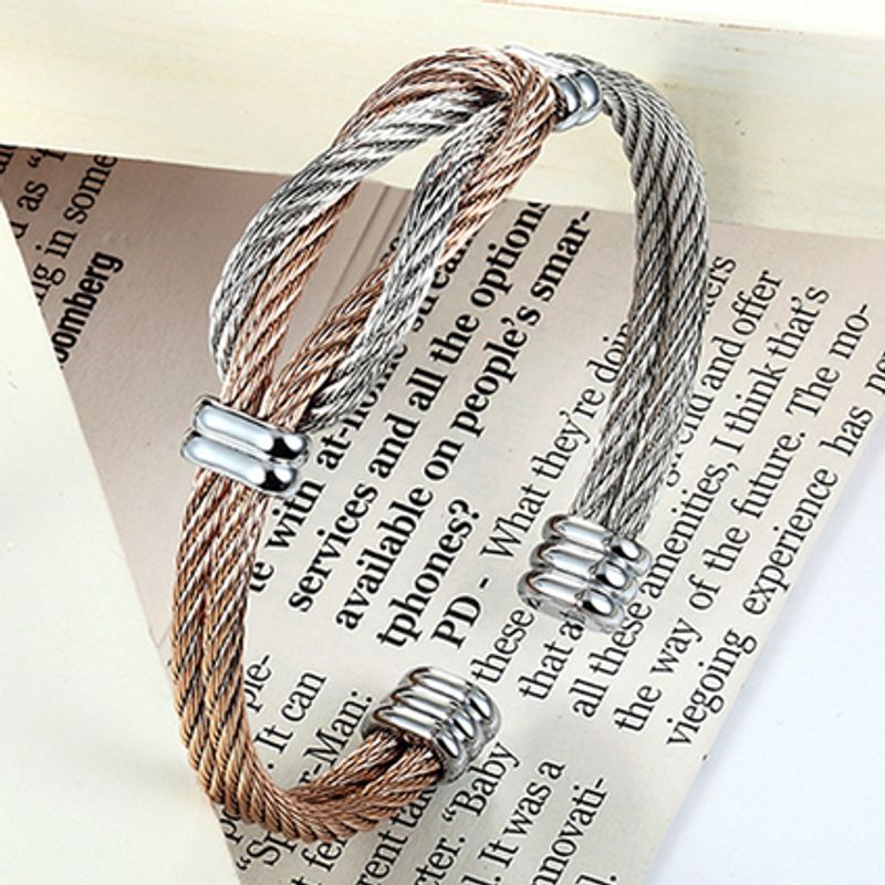 Bracelet manchette nœud de boucles entrelacées à câble en acier inoxydable - coloris argent et or rose