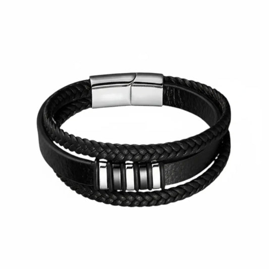Packshot fond blanc. Le bracelet Nexus cuir noir multi-rangs révèle l'architecture de ses motifs rectangulaires bicolores acier argenté et noir.