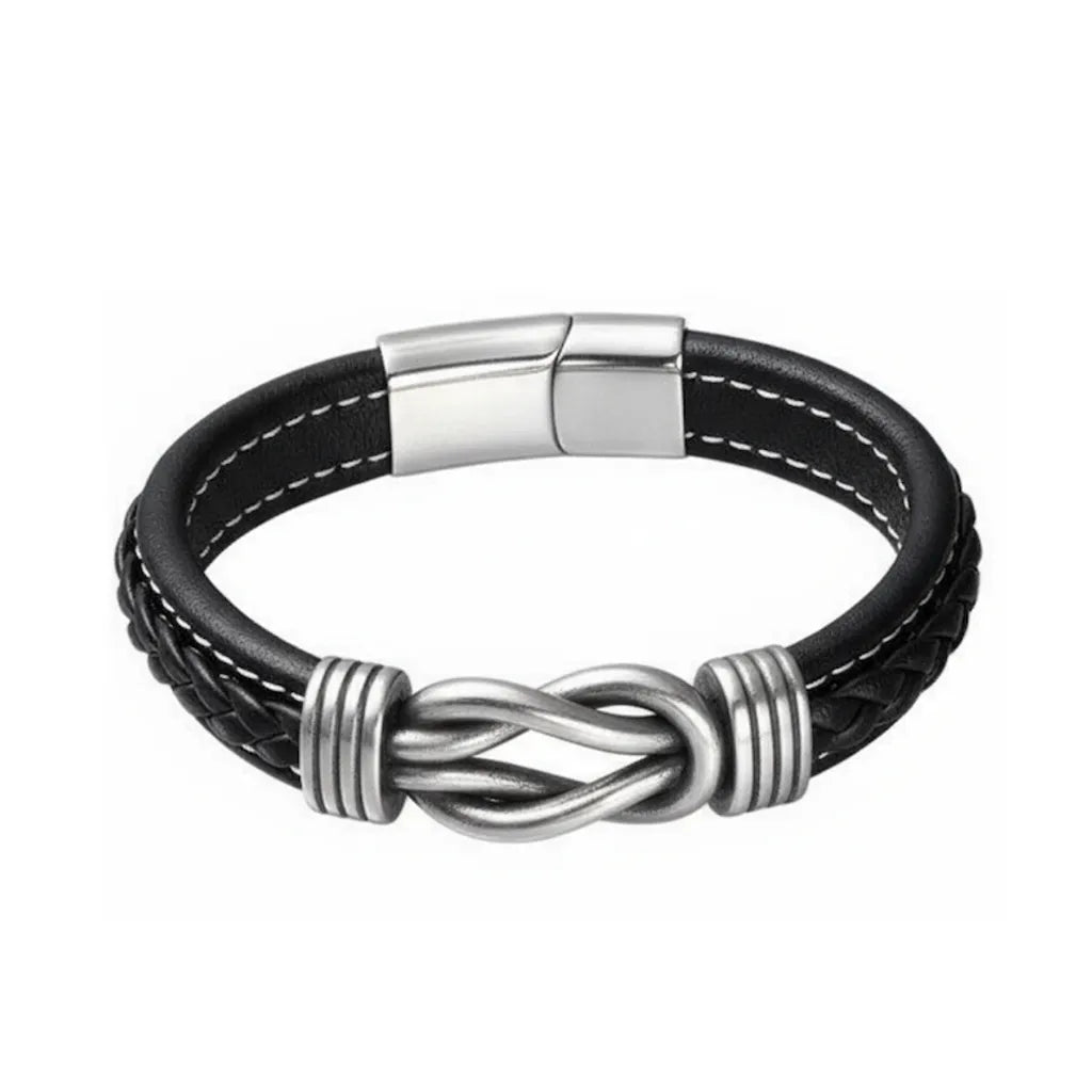 Packshot fond blanc. Le bracelet Noxus cuir noir tressé avec nœud entrelacé en acier poli argenté. L'essence du lien indissociable.