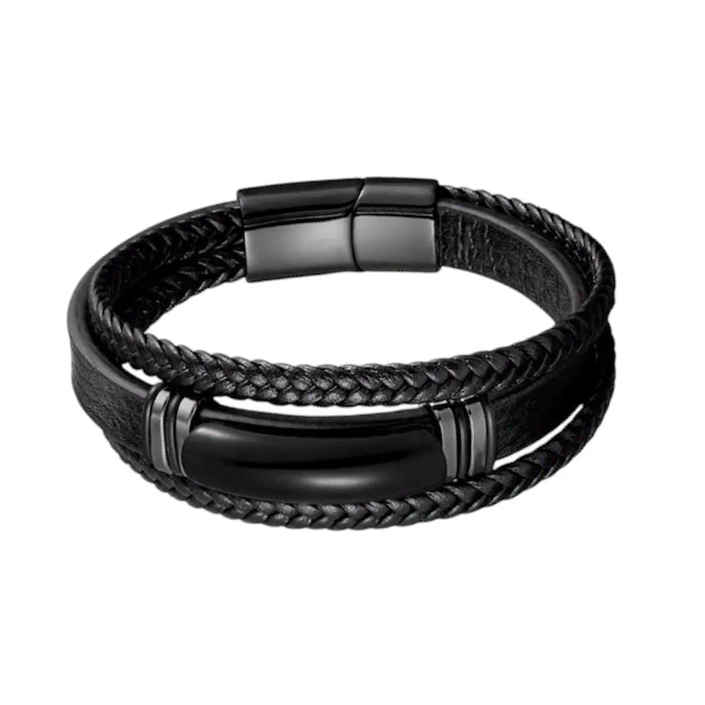 Vue de face du Bracelet Obsidian révélant son agate noire oblongue entre deux lanières tressées et une bande de cuir texturé sur fond blanc.