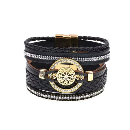 Bracelet Rosace Gothique noir multi-rangs cuir microfibre, contraste sombre et doré, breloque ajourée cerclée de strass brillants.