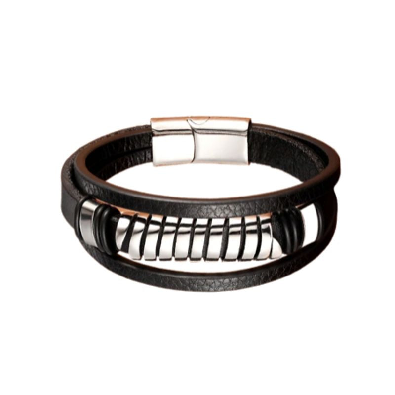 Bracelet spirale acier avec perle tube ajourée, dorée et multilanère en cuir noir. Fermoir magnétique en acier inoxydable de couleur argent.