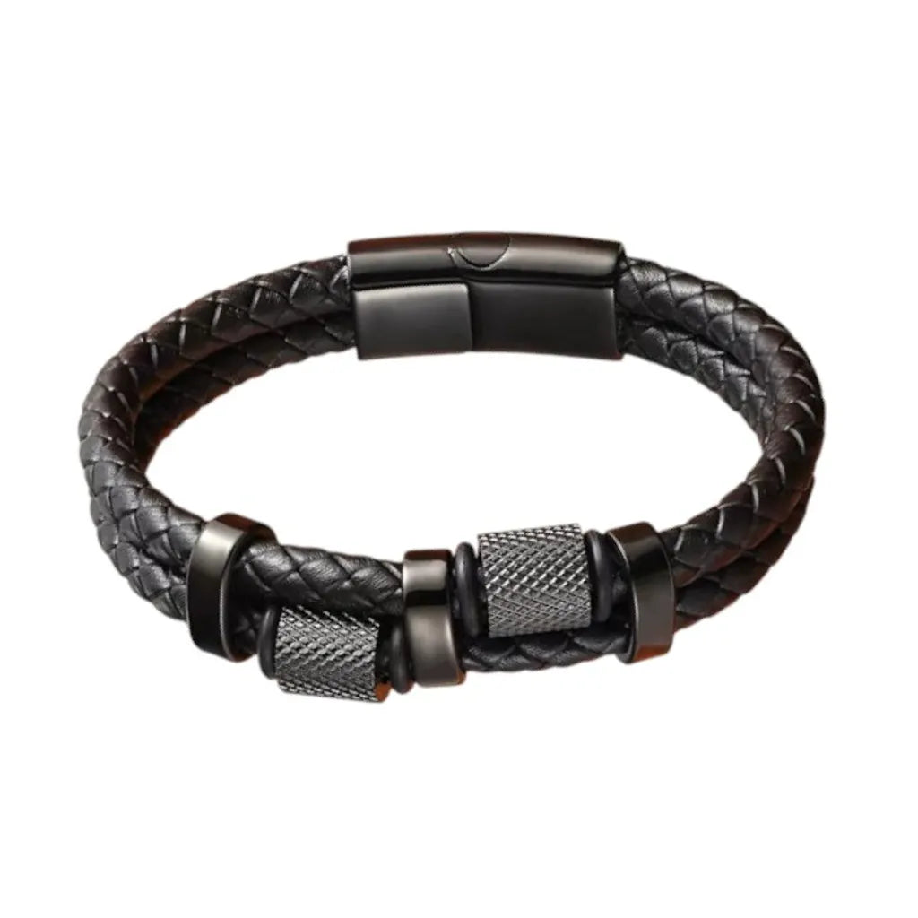 Gros plan finition exclusive. Le bracelet Talon cuir tressé noir et ses cylindres moletés en acier noir mat. L'esthétique brute de la mécanique de précision.