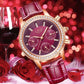 LIGE Diana Cristal, une montre chic avec cadran bordeaux aux brillants ornant le tour de sa lunette et de ses index, son joli bracelet en cuir de coloris bordeaux est en position inclinée, en fond d'image des roses et un verre remplit de vin rouge