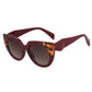 Lunettes de soleil Bengal à verres ronds, monture en forme œil de chat surdimensionnée de couleur ambre et bordeaux pour femme.